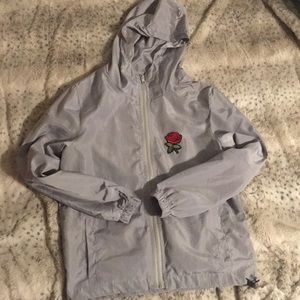 Gray windbreaker with rose patches